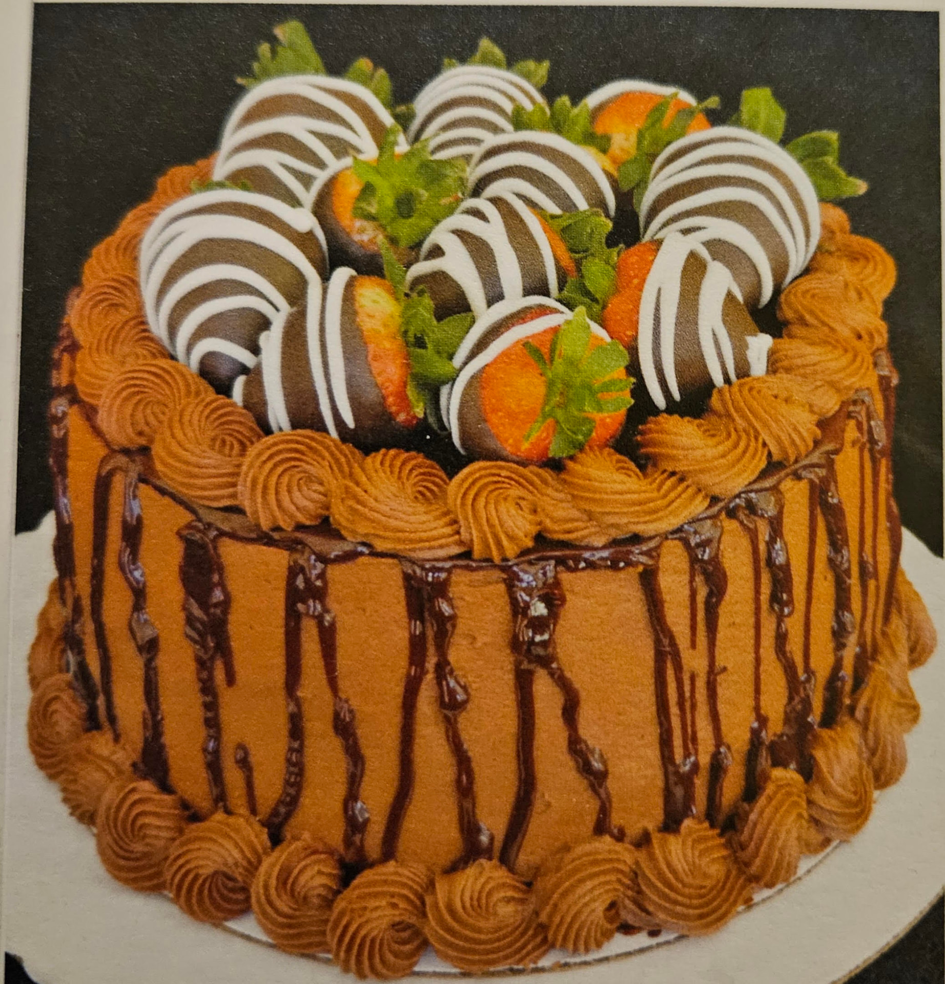 Chocolate cake with chocolate-dipped strawberries